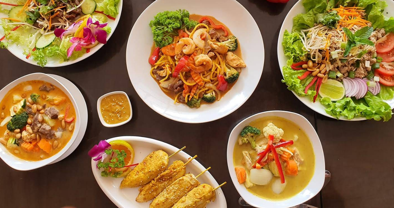 Thai Beach Cafe food spread with curries, noodles, satay and stir-fries